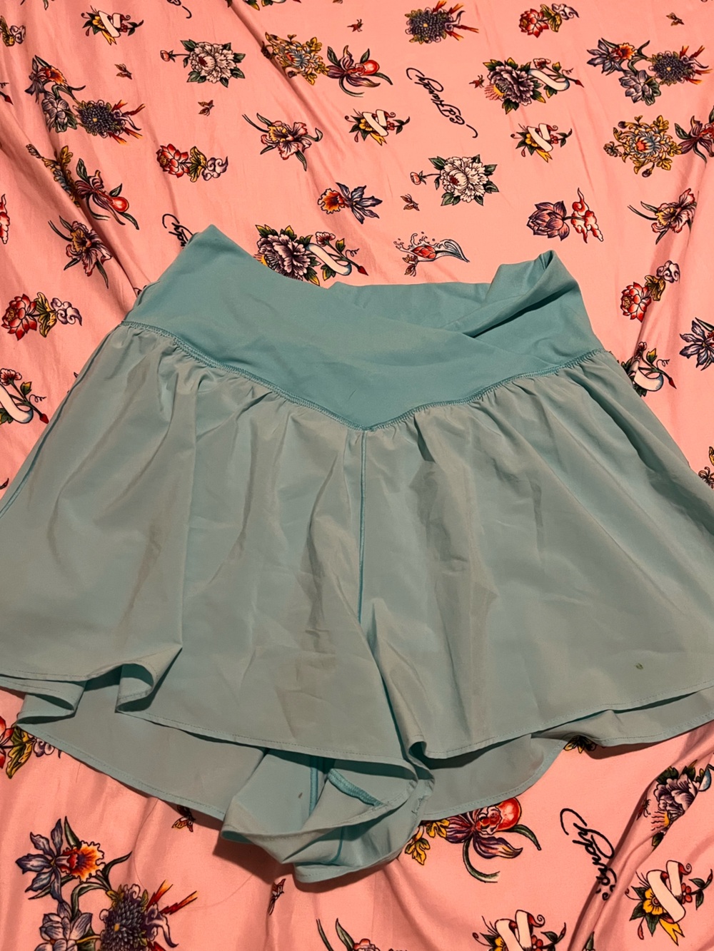 aerie Light Teal Athletic Shorts with small, green paint stain